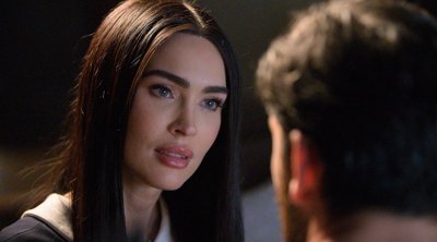 Megan Fox as the domestic android Alice, whose expression hints at something more than programming.