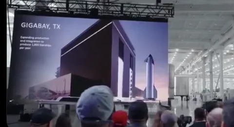 Construction of SpaceX's GigaBay at Starbase, with cranes over the facility.