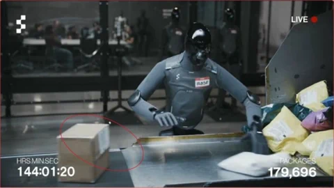 Figure F.03 robot makes a minor error, placing a package with the label down.