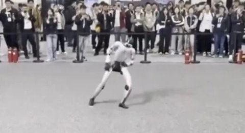 A humanoid robot mid-dance move at the IROS 2025 competition